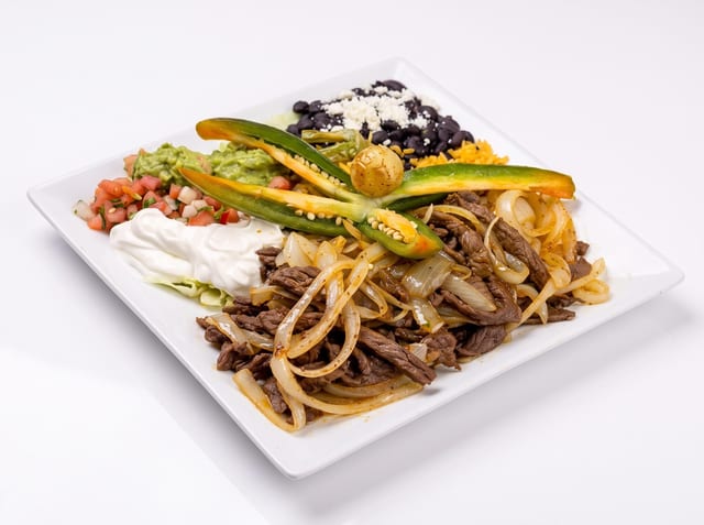 Bistec Encebollado (Steak with Onions).