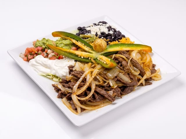 Bistec Encebollado (Steak with Onions).
